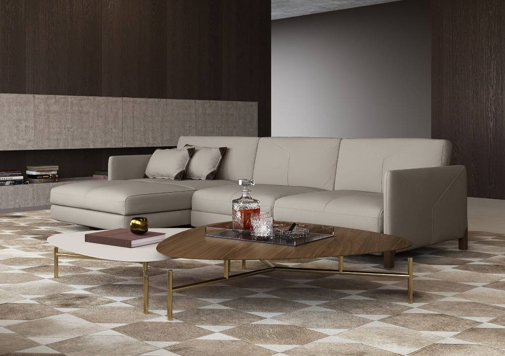 Top grain Brazilian leather sofa with unique stitching and solid wood legs. Available in sectional, standard and loveseat format. Taupe color only.
