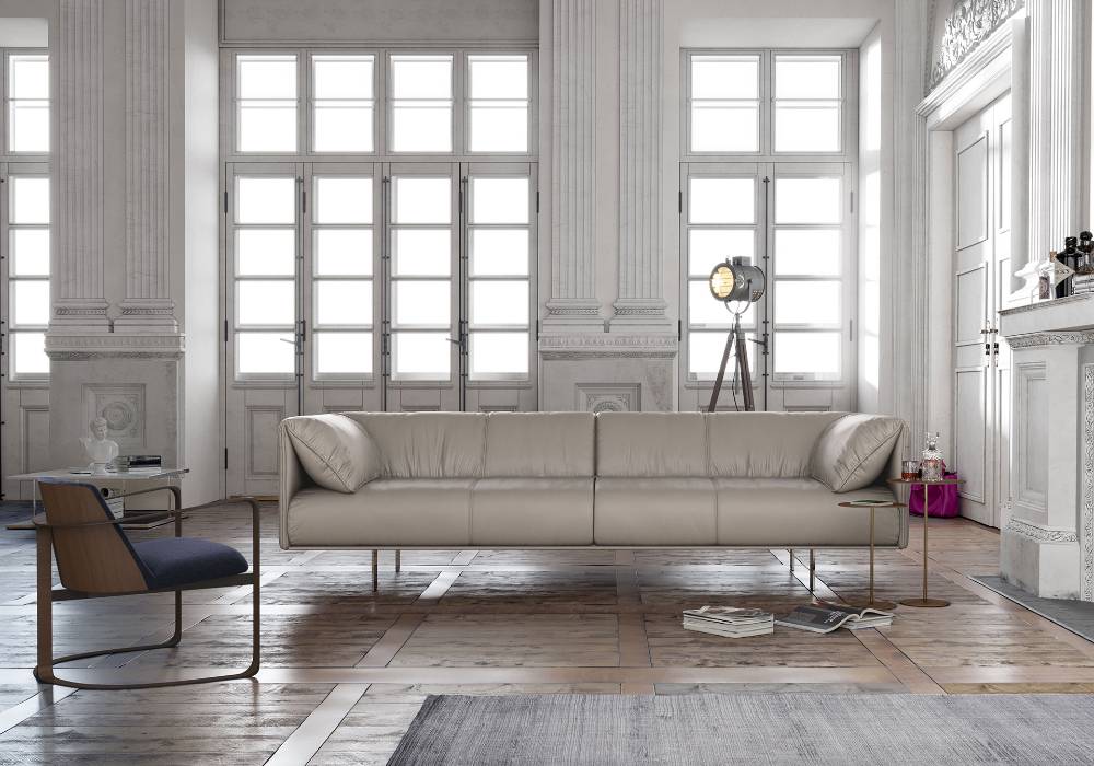 This modern sofa blends low profile design and premium leather, stainless steel legs Available in brown, navy, taupe and gray