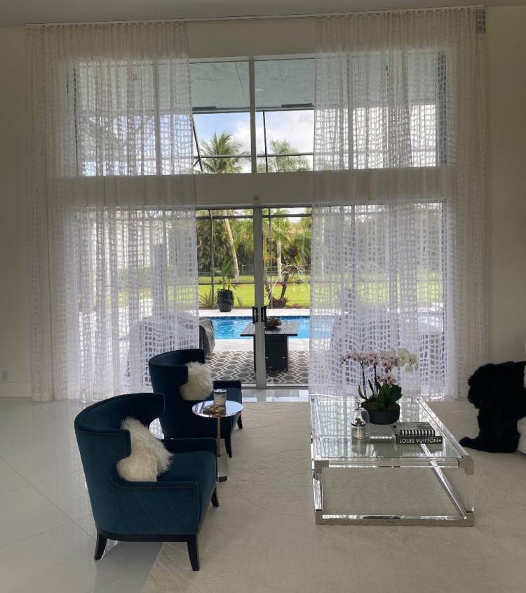 Light white curtains gives you great visibility to the patio